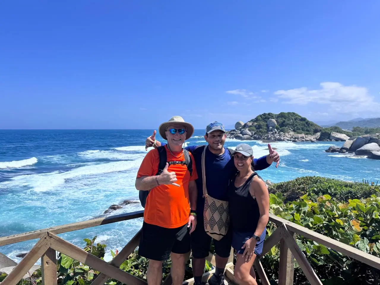 Hugo López with travelers overlooking the Caribbean coast